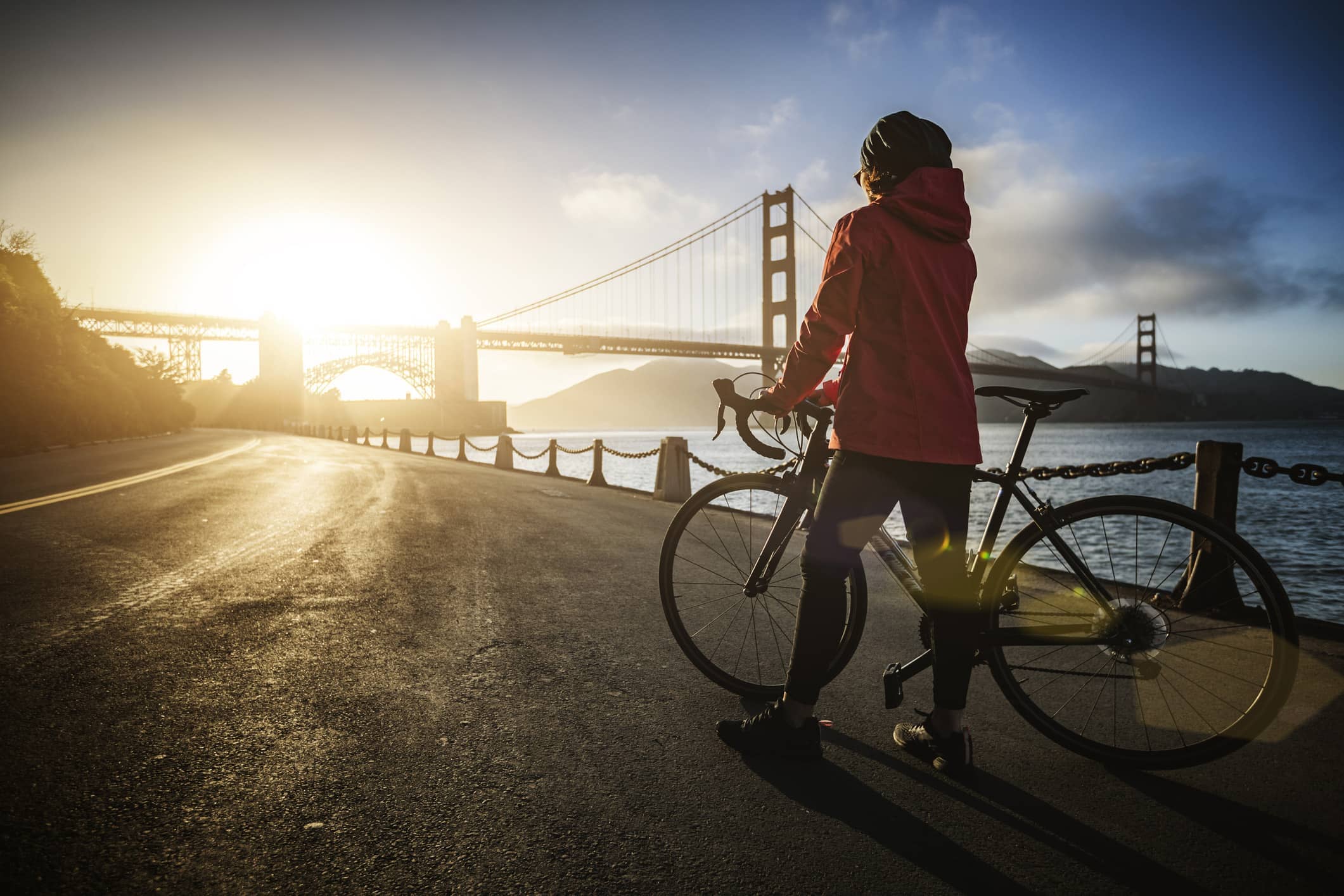 Travel nurse riding a bike near the Golden Gate Bridge in San Francisco, California