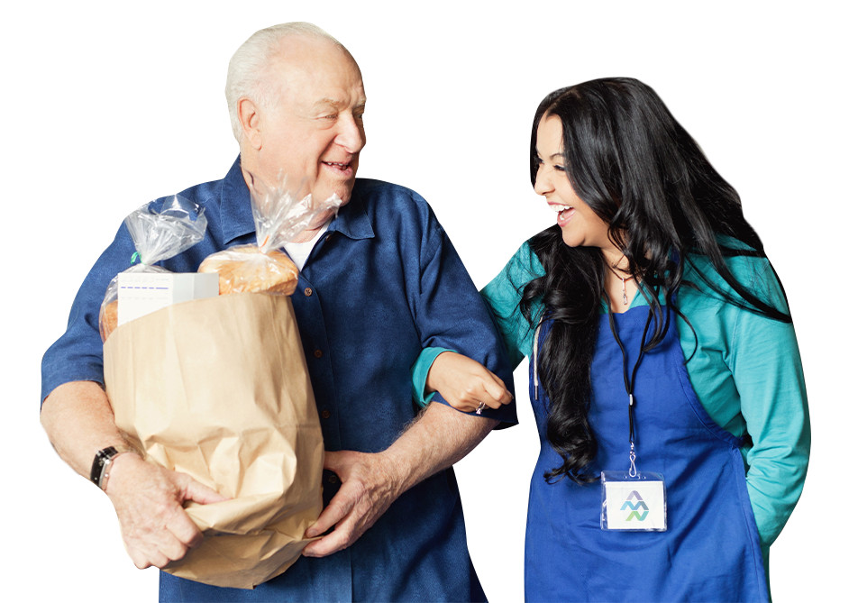 Nurse helping elderly patient who is holding a bag of food