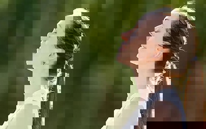 Woman smiling serenely outside Woman smiling serenely outside