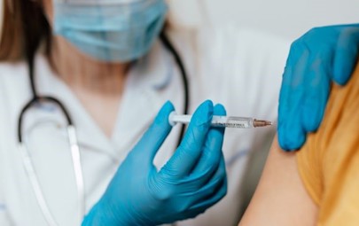 doctor administering covid vaccine doctor administering covid vaccine