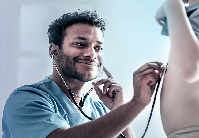 Respiratory therapist listening to child's breathing