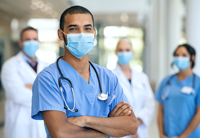 Work stoppage nurse with medical professionals in background