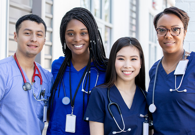 A group of smiling travel nurses