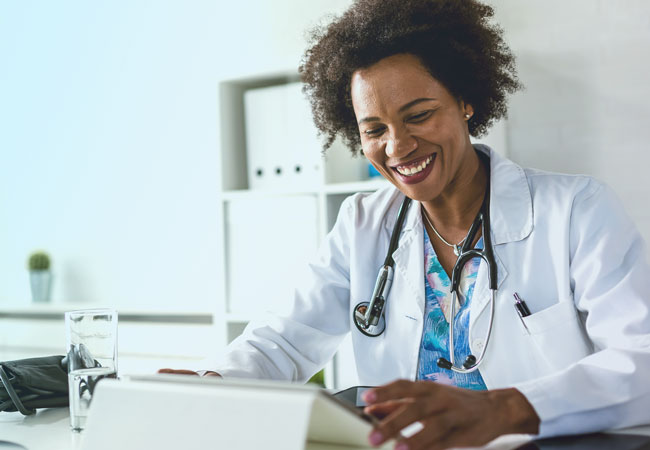Female physician using tablet computer