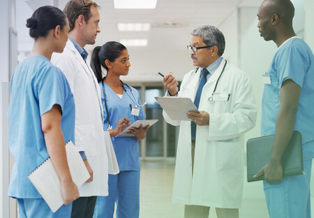 Physician consulting with medical team