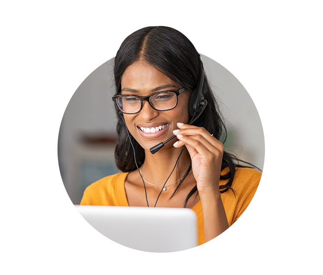 Woman with headset speaking via laptop