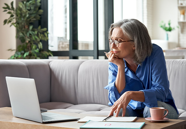 Elderly woman using laptop